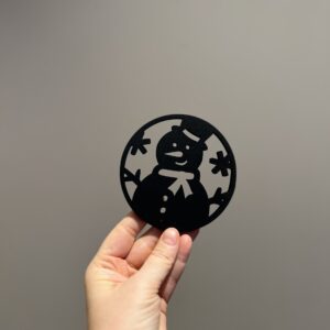 Bilde av den sorte baksiden på jule drikkeunderlag, design 1 av 4.