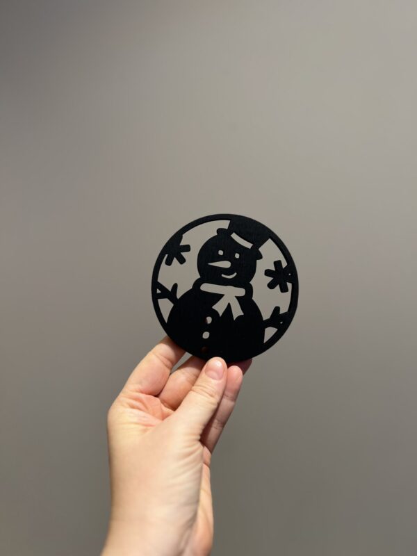 Bilde av den sorte baksiden på jule drikkeunderlag, design 1 av 4.