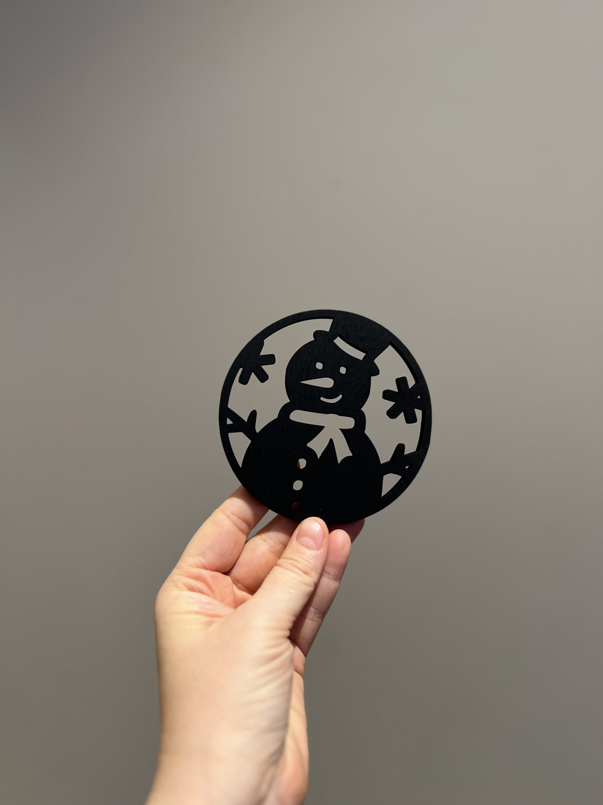 Bilde av den sorte baksiden på jule drikkeunderlag, design 1 av 4.