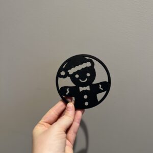 Bilde av den sorte baksiden på jule drikkeunderlag, design 3 av 4.