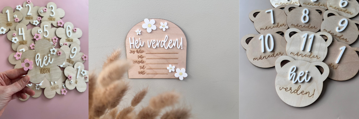 Et bilde av håndlagde milepælskort som henger på en beige vegg, og et fødselsskilt. Begge er utmerket gave til dåp, babyshower, barselsgave og navnefest.